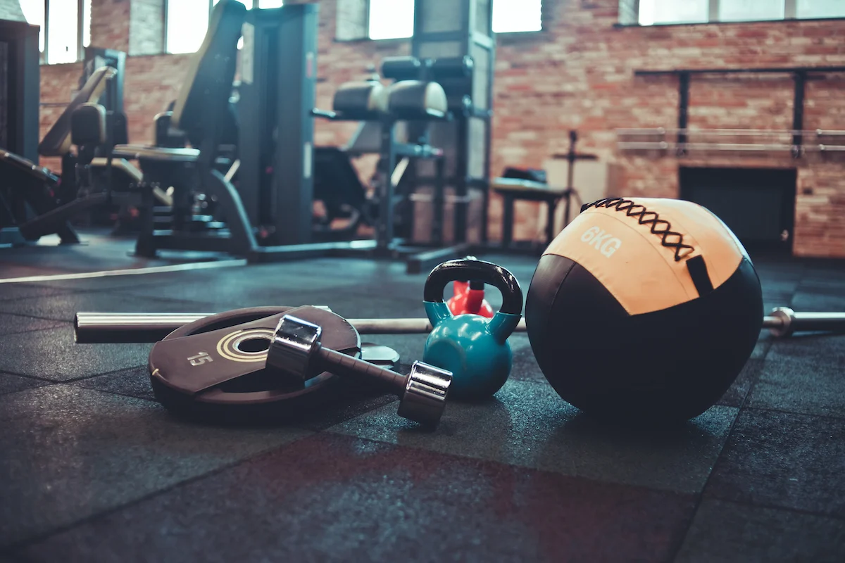 disassembled-barbell-medicine-ball-kettlebell-dumbbell-lying-floor-gym-sports-equipment-workout-with-free-weight-functional-training